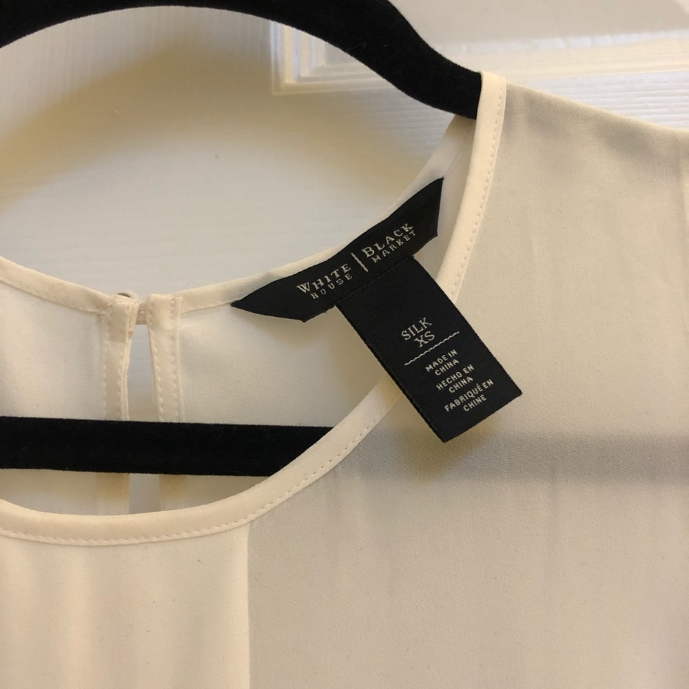 White sleeveless silk top